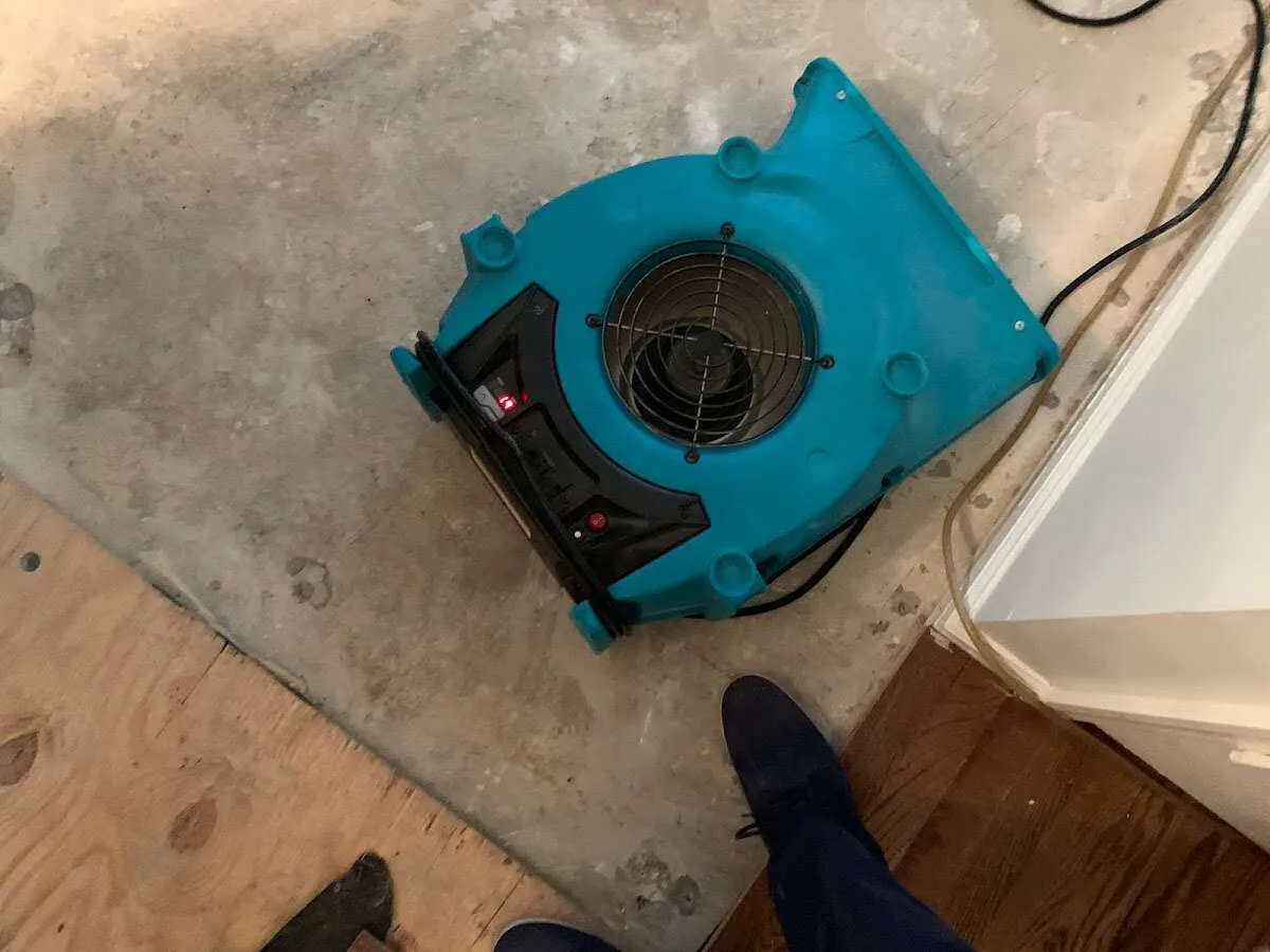 Air mover drying subfloor during Leak Detection & Repair in Shawnee